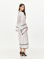 Back side view of the BEYOURA Elysian Draped Hush Robe in coconut milk showing relaxed fit and black edging