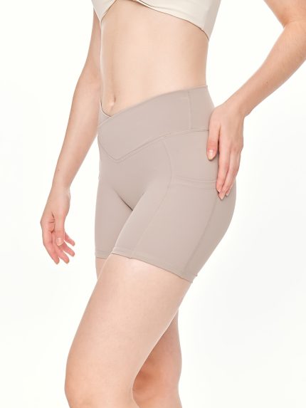 Close-up side-front view of the BEYOURA Elliana V-Line luxeFIT Shorts in beige