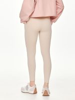 Close-up side-back view of the BEYOURA Estelle Cool Core luxeFIT Leggings in beige