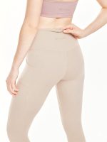 Medium close-up back view of the BEYOURA Estelle Cool Core luxeFIT Leggings in beige
