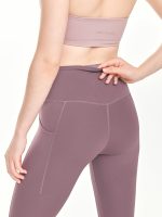 Medium close-up back view of the BEYOURA Estelle Cool Core luxeFIT Leggings in purple
