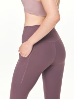 Medium close-up side view of the BEYOURA Estelle Cool Core luxeFIT Leggings in purple with pockets