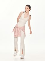 Full front view of the BEYOURA Estelle Flared luxeFIT Leggings in off-white styled with jacket