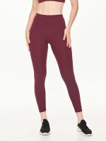 Close-up front view of the BEYOURA Estelle Stretch & Stash luxeFIT Leggings in maroon