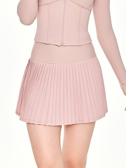 Close-up front view of the BEYOURA Noelle Pleated luxeFIT Skort in pink