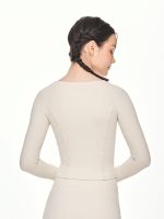 Close-up back view of the BEYOURA Madeleine Body Hugging luxeFIT Jacket in off-white