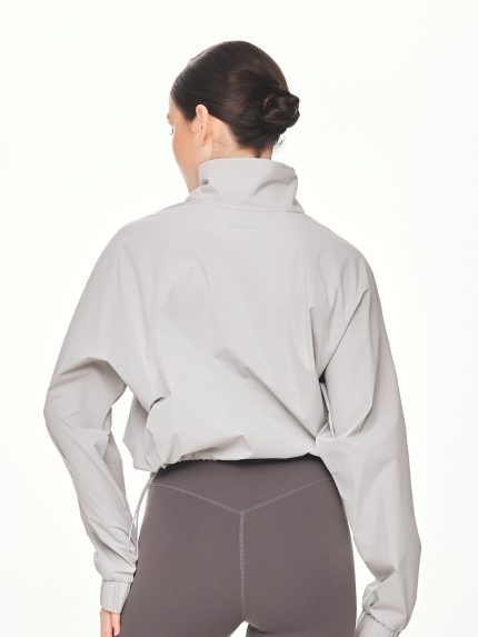 Close-up back view of the BEYOURA Madeleine Cropped luxeFIT Lightweight Pullover in light grey