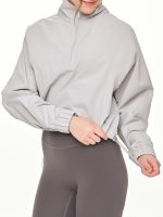 Medium close-up back view of the BEYOURA Madeleine Cropped luxeFIT Lightweight Pullover in light grey