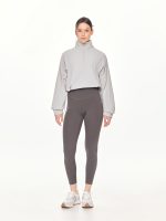 Medium long-shot front view of the BEYOURA Madeleine Cropped luxeFIT Lightweight Pullover in light grey