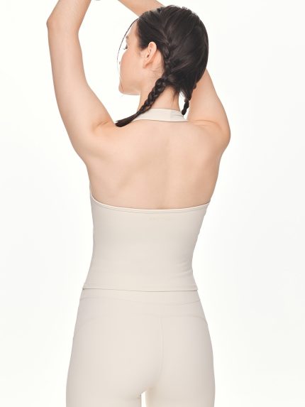 Close-up back view of the BEYOURA Charlotte Halter luxeFIT Top in beige