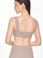 Close-up back view of the BEYOURA Giselle Broad Strap luxeFIT Sports Bra in taupe showing thick supportive straps