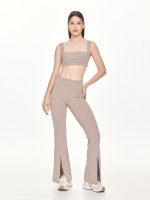 Full front view of the BEYOURA Giselle Broad Strap luxeFIT Sports Bra in taupe styled with flared leggings