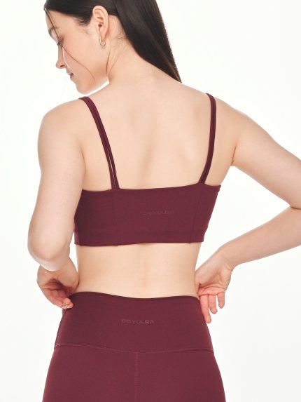 Close-up back view of the BEYOURA Giselle Duostrap luxeFIT Sports Bra in maroon