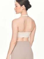 Close-up back view of the BEYOURA Giselle Halter luxeFIT Sports Bra in off-white