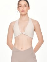 Close-up front view of the BEYOURA Giselle Halter Strap luxeFIT Sports Bra in off-white