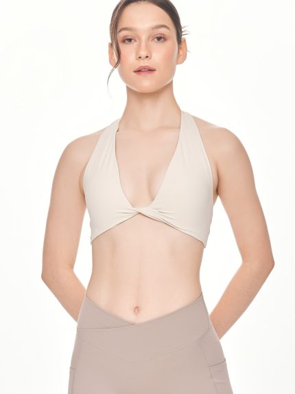 Close-up front view of the BEYOURA Giselle Halter Strap luxeFIT Sports Bra in off-white