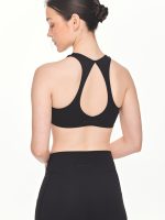 Close-up back view of the BEYOURA Giselle Twist luxeFIT Sports Bra in black