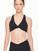 Close-up front view of the BEYOURA Giselle Twist Strap luxeFIT Sports Bra in black
