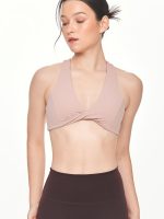 Close-up front view of the BEYOURA Giselle Twist Strap luxeFIT Sports Bra in pink
