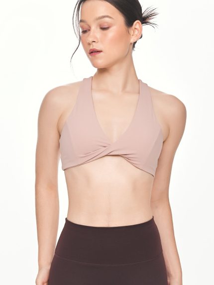 Close-up front view of the BEYOURA Giselle Twist Strap luxeFIT Sports Bra in pink